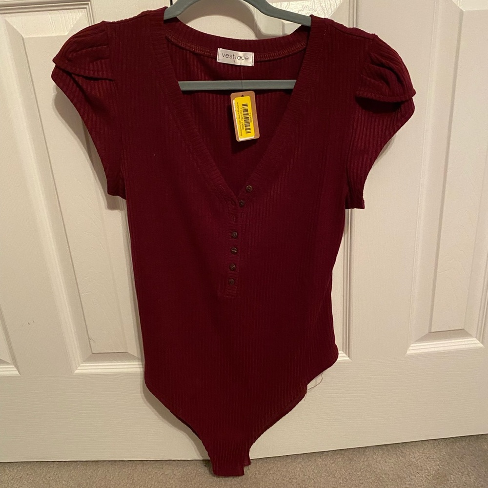 Maroon bodysuit with button front and cap sleeves from Vestique.